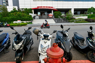 Scooters parked at the entrance of the Taiwan Semiconductor Manufacturing (TSMC) Museum of Innovation in Hsinchu Science Park.