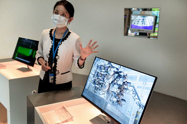 A member of staff with a display inside the Industrial Technology Research Institute (ITRI) museum and showroom at the ITRI.