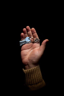 Basel, 35, with the keys to his home in Aleppo, that he fled 2 years previously. He describes his home as "It had some trees".  Syrian Nakba, Keys of home. The front-door keys to the homes of some of...