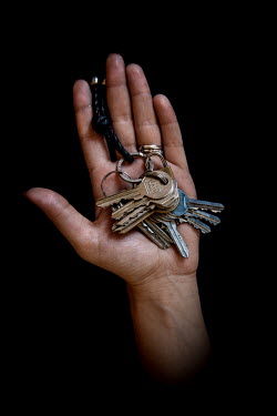Hadeel, 28, with the keys to his home in Damascus that he fled 1 year, 10 months previously. He describes his home as "My soul".  Syrian Nakba, Keys of home. The front-door keys to the homes of some o...