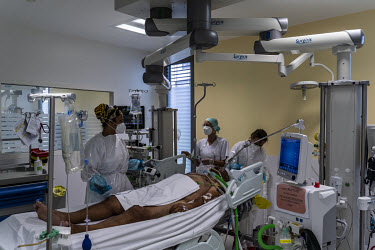 Nurses treat a COVID-19 patient in the intensive care COVID ward of the Medipole Hospital. Many New Caledonians felt France's response to the COVID crisis highlighted the benefits of remaining part of...