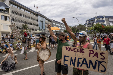 Protesters against the mandatory vaccination and coronavirus passport vaccination schemes protest outside the New Caledonian government headquarters.