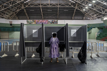 A woman from Ouvea who is registered to vote in Noumea, selects her voting choice in the 2021 independence referendum. Ouvea is largely pro-independence and was a flash point in the unrest in the eigh...