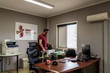 Antonin Beurrier, chief executive officer of Prony Resources, with a coffee at his desk in the Prony Resources nickel mine site office.