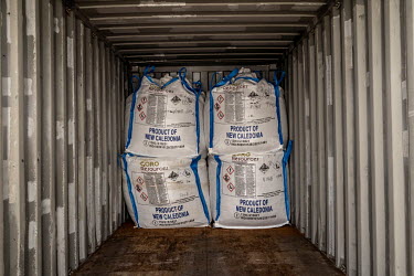 Sacks of processed nickel loaded into containers prior to shipping at the Prony Resources nickel mine plant.