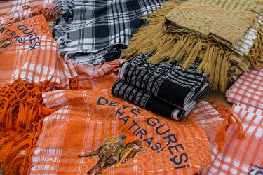 Traditional scarves worn by camel owners, trainers and fans, embroidered with camels, for sale around the competing arena at the 35th Selcuk Camel Wrestling Festival.