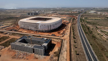 An aerial view of Diamniadio, a new city being built near Dakar. In the foreground is the Amadou Makhtar Mbow University and the Stade du Senegal, both still under construction.