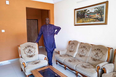 Seydina Amza Toure, in the living room of a furnished flat that he is renting in Senegindia's SD City residential and commercial complex in Diamniadio, a new city being built near Dakar.
