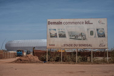 A billboard advertisement at the construction site for the Stade du Senegal in Diamniadio, a new city being built near Dakar.