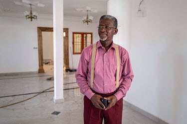 Francis Do Rego inside the house he bought in Diamniadio, a new city being built near Dakar, which he had to completely rebuild because the foundations were not suited to the type of clay soil in the...