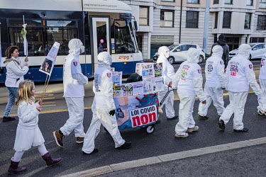 Demonstration against Covid 19 vaccination and masks for children. The cortege carried white coffins with childrens' names and 'brought to you by Pfizer' emblazoned on them evoking children killed by...