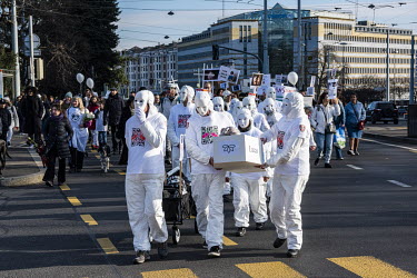 Demonstration arriving at the Place des Nations outside the UN against Covid 19 vaccination and masks for children. The cortege carried white coffins with childrens' names and 'brought to you by Pfize...