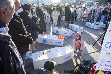 Demonstration arriving at the Place des Nations outside the UN against Covid 19 vaccination. The cortege carried white coffins with childrens' names and 'brought to you by Pfizer' emblazoned on them e...
