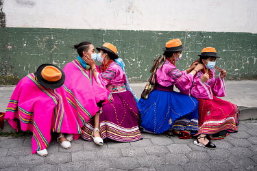Indigenous youth from the dance troupe 'Mashi Danza' rest after their participation in the 'National March for Democracy' that arrived in Cotopaxi on the afternoon of 22 February 2021, demanding trans...