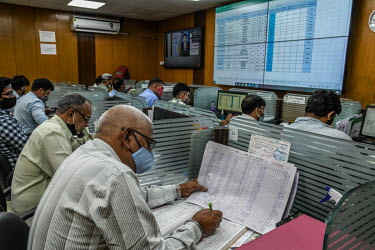 Employees work in oxygen control room in DTC headquarters.