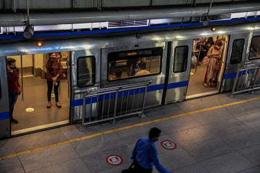 Commuters on a metro train at a station after services resumed at 50 percent capacity following the easing of the COVID-19 lockdown as infections across the country fell to a two month low.