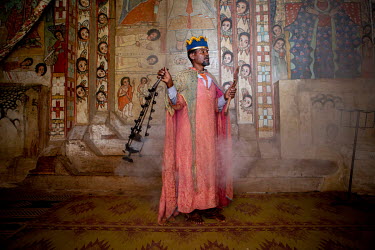 A priest performs musical rituals in Narga Sellaisie church