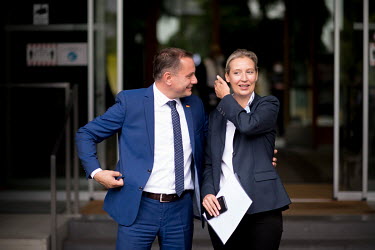 Alice Weidel, leader of the right-wing Alternative fuer Deutschland (AfD), Alternative for Germany, and party co-chair Tino Chrupalla speak outside a press conference the day after the federal electio...