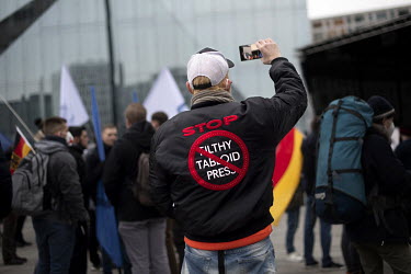 Protester wears a jacket which reads 'Stop [the] Filthy Tabloid Press' in a demonstration against the media by Junge Alternative JA, the youth organization of the right wing extremist party Alternativ...
