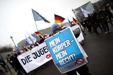 Male protester with poster reading My Body My Choice at a rally and demonstration by the Junge Alternative JA, the youth organization of the right wing extremist party Alternative for Deutschland agai...