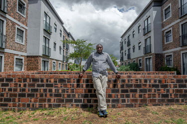 Benjamin Kagina, a vaccinologist with Vaccines for Africa, photographed outside his home in Cape Town, South Africa.