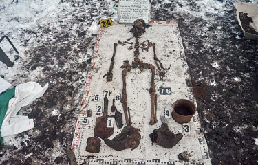 The skeleton of a Red Army solidier laid out on a canvas with his belongings. Remains found by Slavyansk Black Tulip are stored at a local garage until the next Victory Day on the 9th May, when all th...