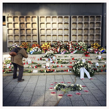 A man takes photos of flowers and candles at a memorial for the Christmas market terrorist attack in Breitscheidtplatz in 2016. It is the 5th anniversary of the event. On December 19 Anis Amri, a Tuni...