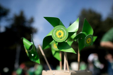 A papere windmill of the Green party Buendnis 90 Die Gruenen, on a campaign stall.