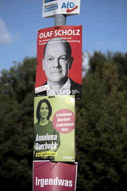 An election poster for the SPD with photo of Olaf Scholz, candidate for chancellor of the SPD, and the Green party Partei Buendnis 90 Die Gruenen with photo of Annalena Baerbock, chancellor candidate...
