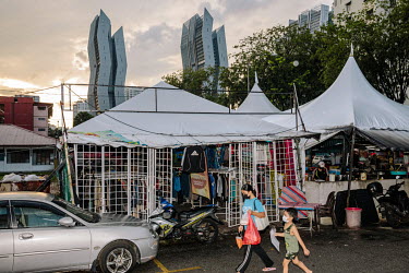 The entrance to Mad X Station bundle shop. People in Malaysia use the term 'bundle' for secondhand shopping, a reference to the large bales that local clothing merchants buy from wholesalers. The term...