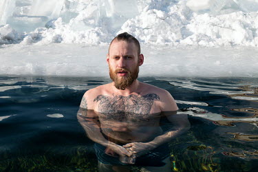 Egor Lesnoy, a blogger and activist from Irkutsk swims in a pool cut through the frozen surface of Lake Baikal. He took a great interest in diving and scuba diving in the lake and began to collect rub...