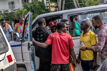 Passengers try to resolve an argument between a driver of commercial transportation bus, popularly known as 'Danfo', and other drivers travelling along the Lekki-Epe expressway, which is notorious for...