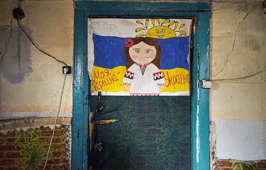 A mural painted on a door door with a slogan that reads: "My country, Ukraine" at a Ukrainian military intelligence post not far from the frontline.