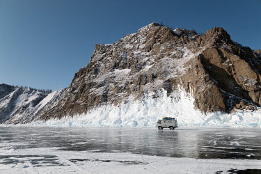 A tour bus on the ice at Cape Khoboy on the northern part of Olkhon Island.