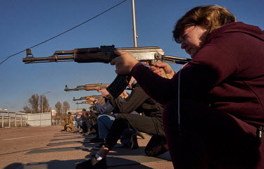 Civilians learn how to hold and shoot a rifle as the Azov Battalion conducted military training for citizen volunteers. About hundred people learned first aid and how to use rifle. It was the first ti...
