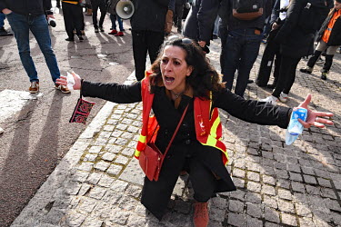 An upset woman shouts at a counter demonstration during a rally for far right presidential candidate Eric Zemmour.