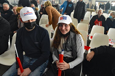Supporters of far right presidential candidate Eric Zemmour wear campaign branded hats at a rally in Burgundy.