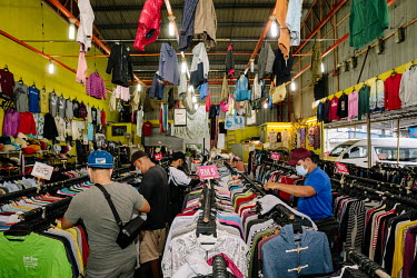 Sora Bundle, a long established secondhand store on the outskirts of the city. People in Malaysia use the term 'bundle' for secondhand shopping, a reference to the large bales that local clothing merc...