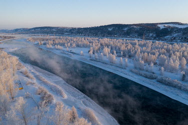 Frozen banks along the Angara River which never freezes because of its fast flow rate.