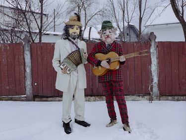 People dressed-up in character for a rural winter carnival.