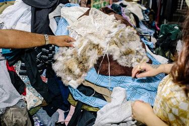 Amirul Ruslan and Catherine Liew shopping in Mad X Station bundle shop in the city. People in Malaysia use the term 'bundle' for secondhand shopping, a reference to the large bales that local clothing...