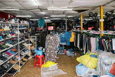 Bundle Murah, a small secondhand store on the outskirts of the city. People in Malaysia use the term 'bundle' for secondhand shopping, a reference to the large bales that local clothing merchants buy...