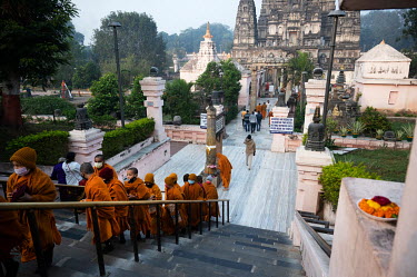 Buddhist monks and other visitors at a Buddhist pilgrimage site.