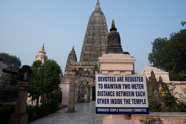 A sign to remind pilgrims about social distancing at a Buddhist pilgrimage site.
