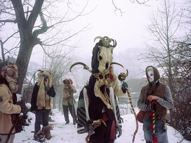 A group of people dressed up in costumes and wearing masks and headgear during a Malanka (also known as Pitsarai, Jocul Ursului (bear dance), Capra (goat) and Cerb (deer), a pagan New Year's celebrati...