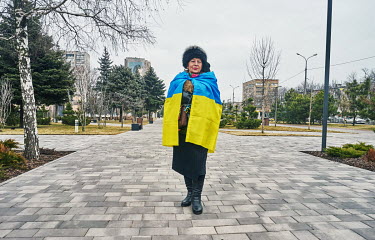 Ludmila (65) wrapped in an Ukrainian national flag during a 'Day of Unity' on Freedom Avenue. President Volodymyr Zelensky has declared 16 February 2022, cited as a possible invasion day, as a 'Unity...