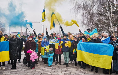 A group of patriotic residents, several wrapped in the Ukrainian national flag, during a 'Day of Unity' on Freedom Avenue. President Volodymyr Zelensky has declared 16 February 2022, cited as a possib...