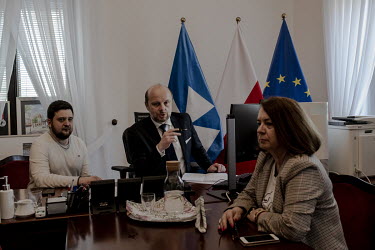 Lubomir Eder (L), from Lviv, in Rzeszow town hall with the town president, Konrad Fijolek, and the vice-president, Krystyna Stachowska, during a zoom meeting to discuss the Russian invasion and the re...