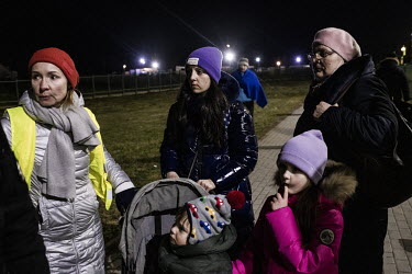 A group of women and children fleeing the Russian invasion of Ukraine arrive on Polish soil after crossing the Medyka â�" Shehyni border point. Many Poles and expatriate Ukrainians have also travelle...