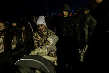 People fleeing the Russian invasion of Ukraine arrive on Polish soil after crossing the Medyka â�" Shehyni border point. Many Poles and expatriate Ukrainians have also travelled to Polish/Ukrainian b...